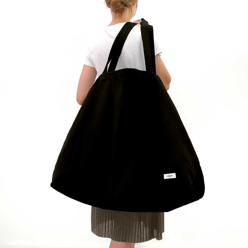 woman holding organic cotton weekend bag