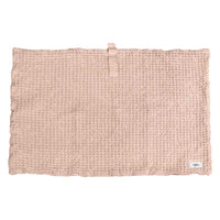 pink bath mat in waffle print
