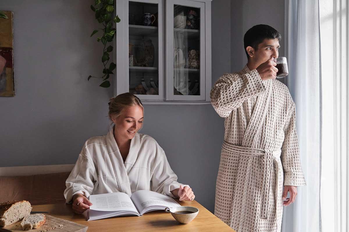 man and woman wearing big waffle bathrobe