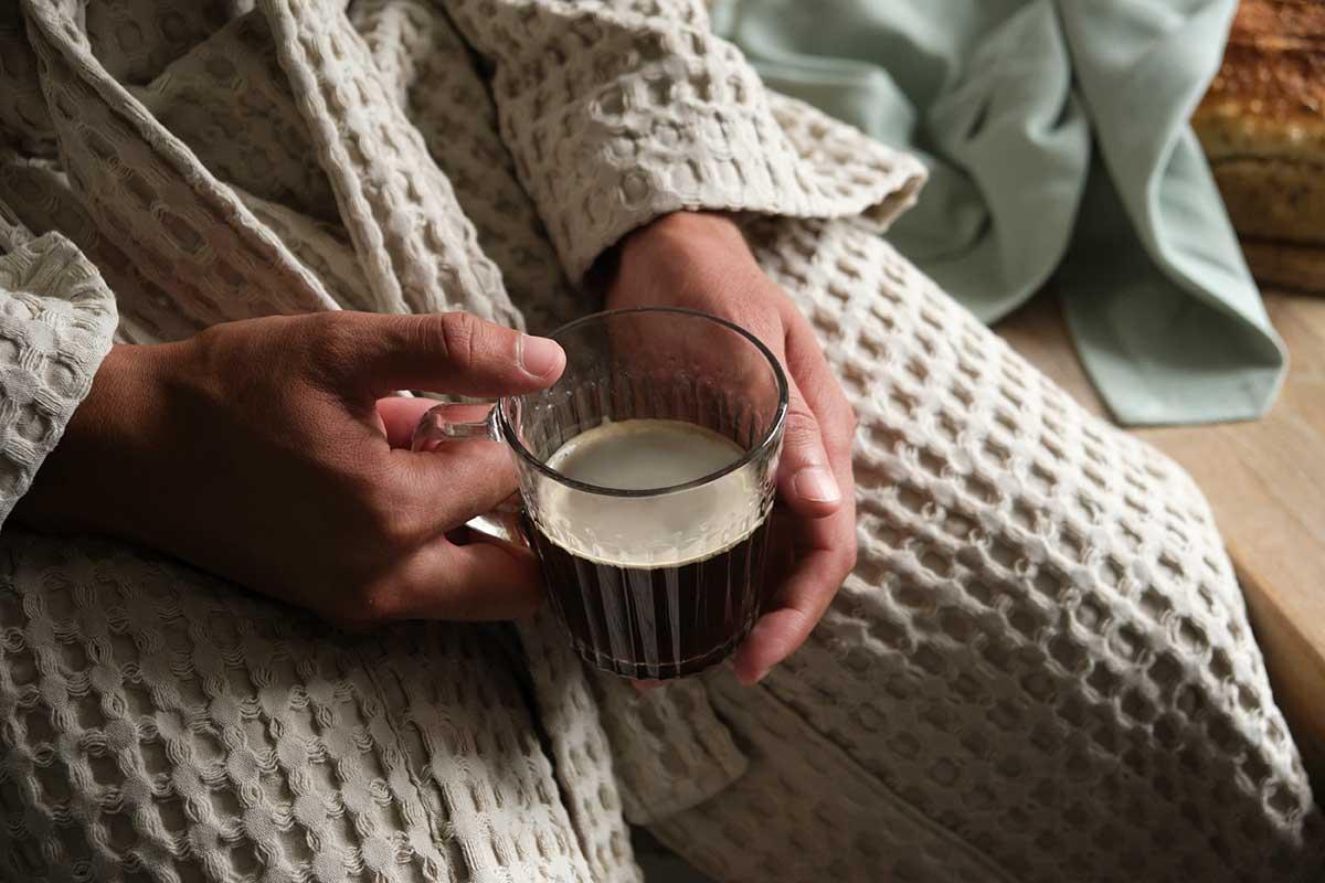 man holding a coffee