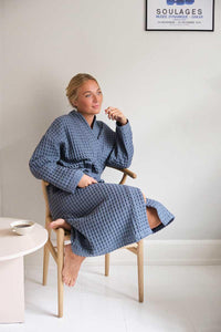 woman wearing blue bathrobe