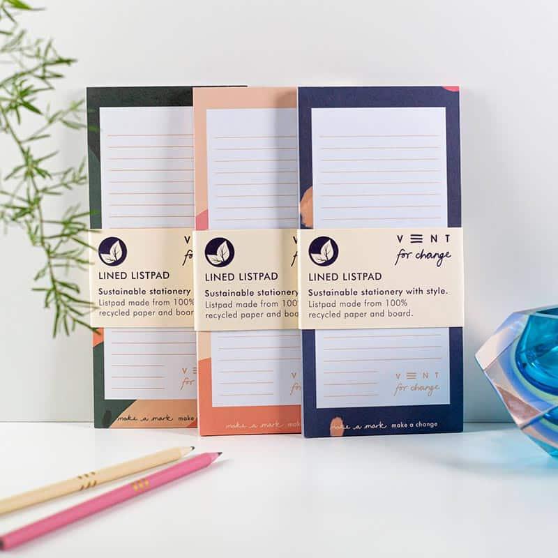 3 recycled paper list pads next to each other