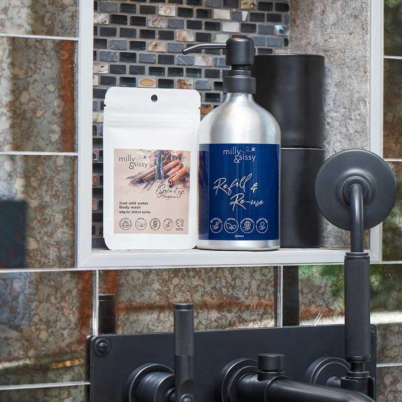 milly and sissy spice it up body wash set next to shower