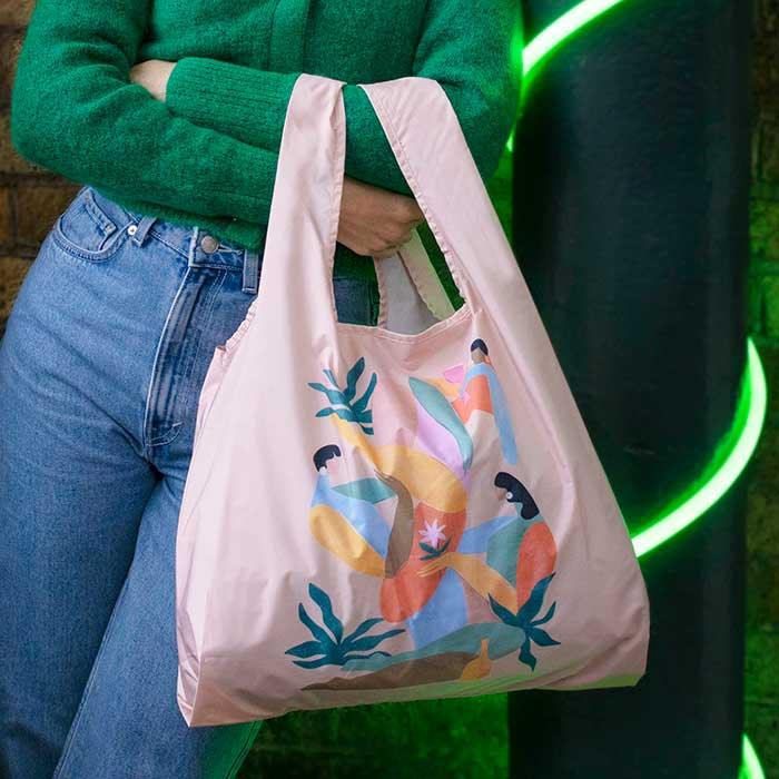 woman with a a summer afternoon reusable shopping bag