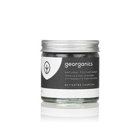 charcoal toothpowder in a glass jar