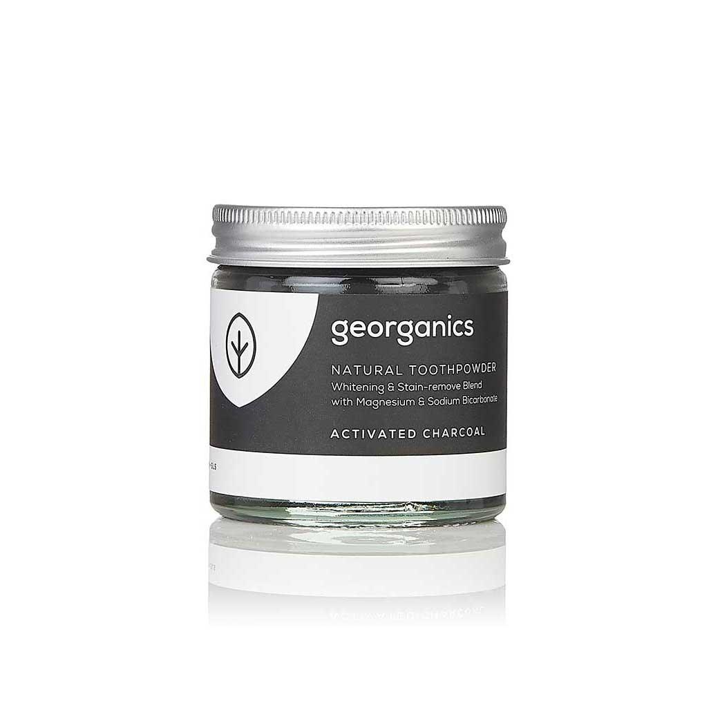 charcoal toothpowder in a glass jar