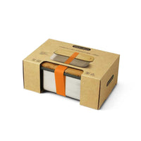 lunchbox with bamboo lid inside cardboard packaging