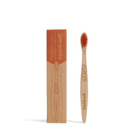 Kids Beechwood Toothbrush next to packaging