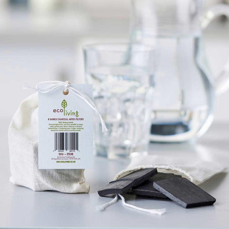 bamboo charcoal water filter beside cotton pouch