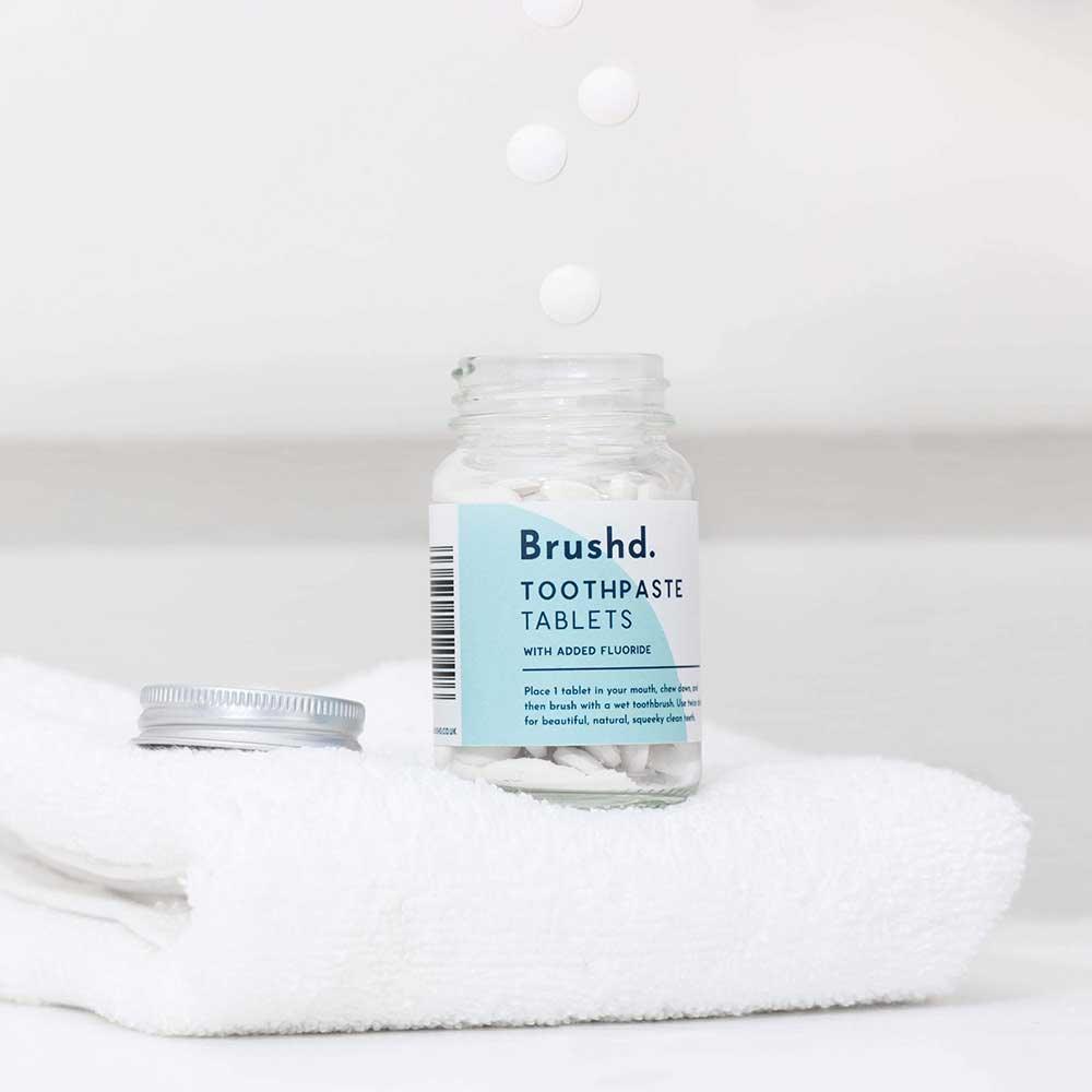 brushd toothpaste tablets in glass jar