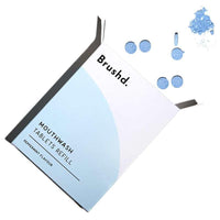 mouthwash tablet refills laid on a table
