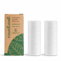 natural floss refill next to packaging