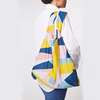 woman carrying reusable shopping bag