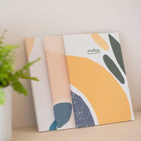 vent for change notes book leaning on wall