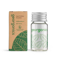 natural floss next to packaging