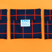 reusable shopping bag on orange background