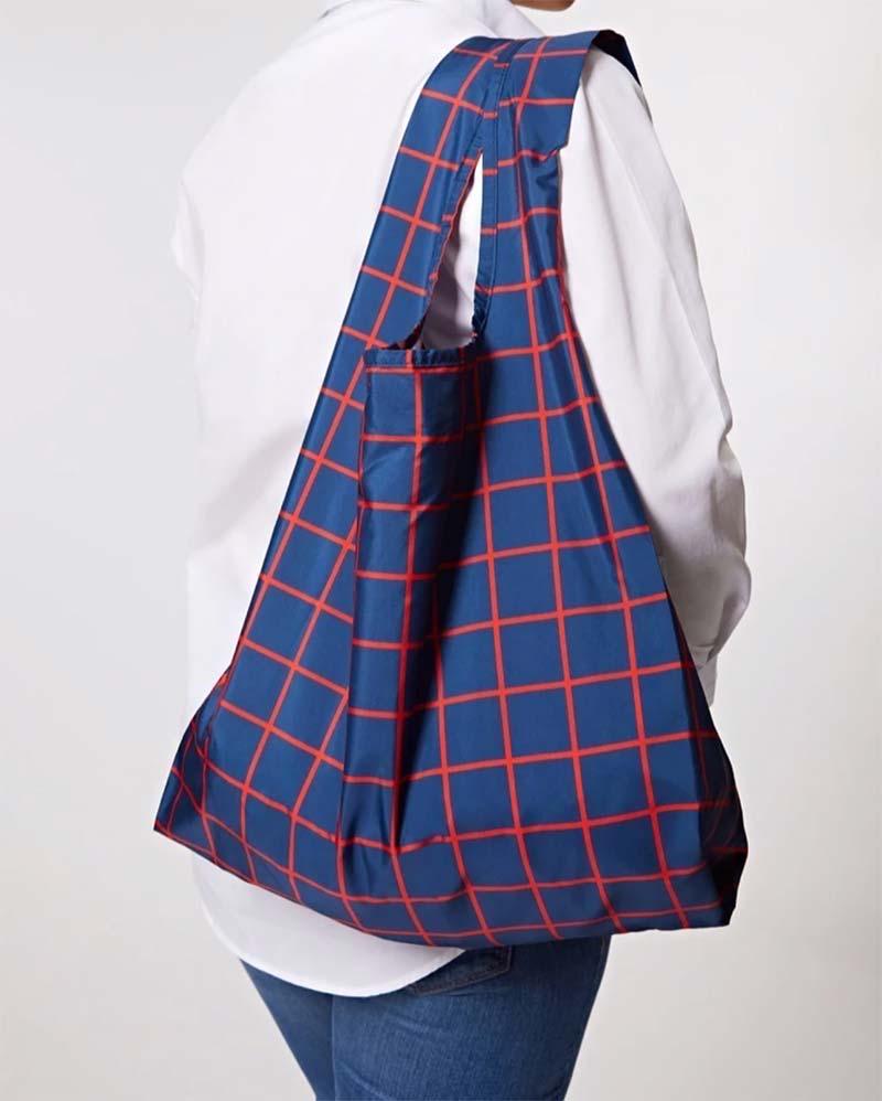 reusable shopping bag over a woman's shoulder