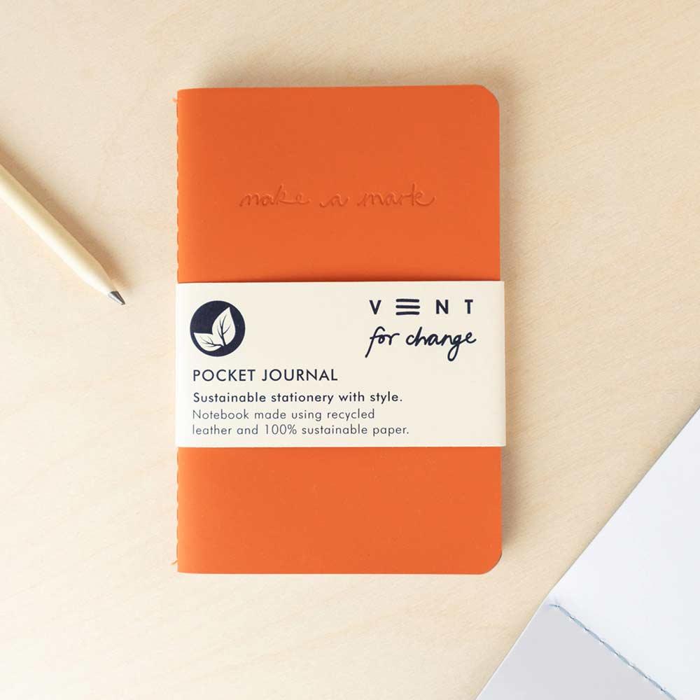 recycled leather pocket journal flat on desk