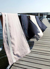 the organic company wellness towel hanging on a washing line