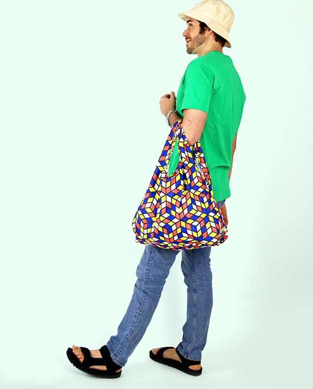 man holding cubes print shopping bag