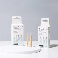 plastic free interdental burshes next to packaging