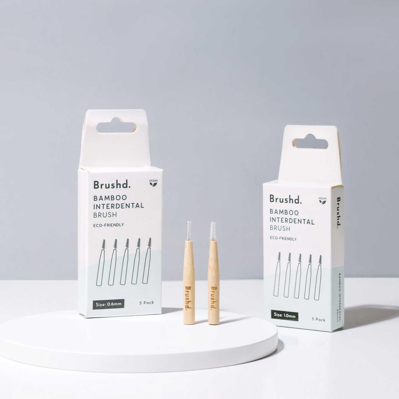 plastic free interdental burshes next to packaging