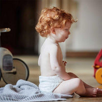 baby wearing little lamb bamboo nappy
