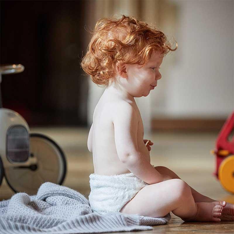 baby wearing little lamb bamboo nappy