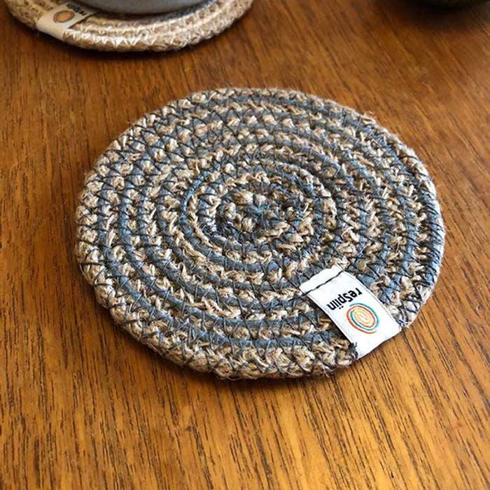 grey natural coaster on a table top