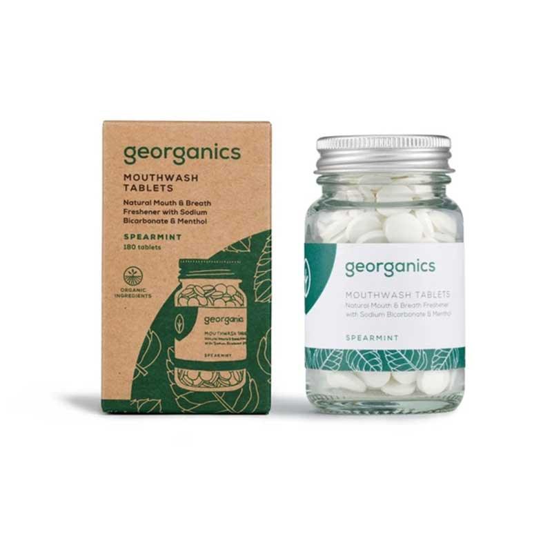 mouthwash tablets in glass jar next to packaging