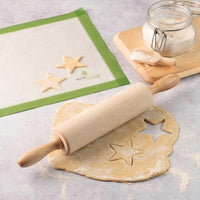 wooden rolling pin on a kitchen worktop
