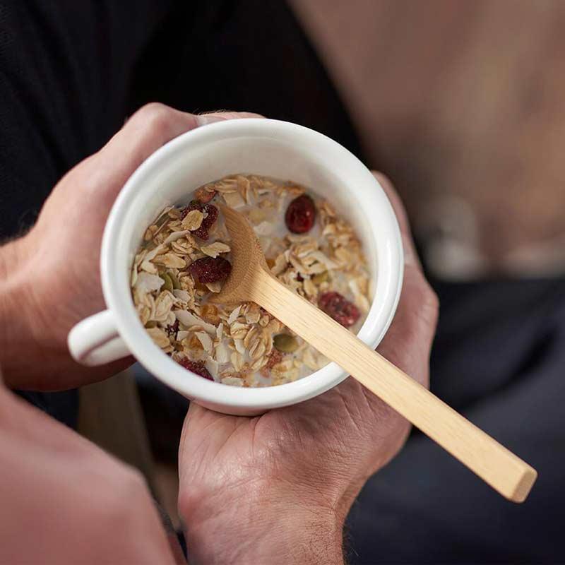 long handle bamboo spoon inside a cup