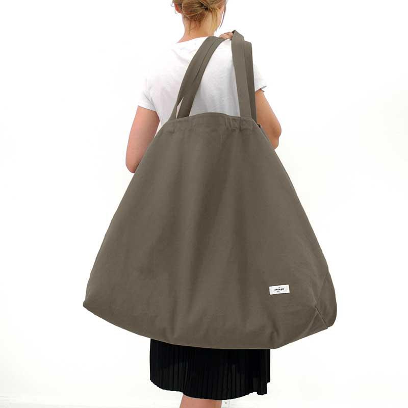 woman carrying extra large cotton bag