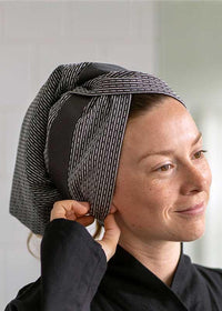 woman with an organic cotton hair towel