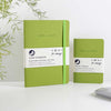 green notebook and pocket journal