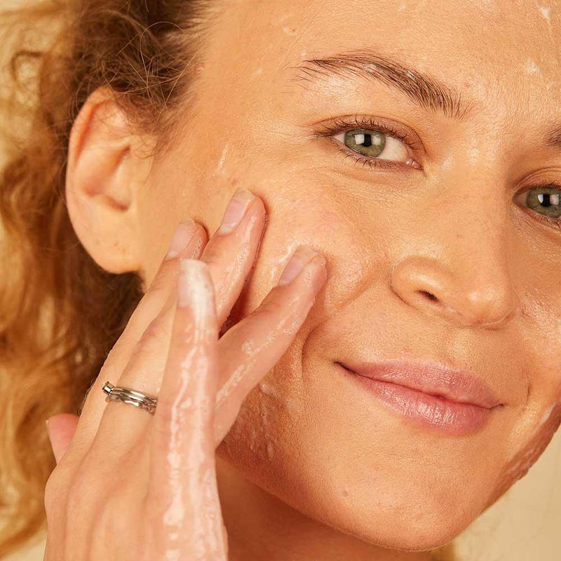 woman using jelly cleanser