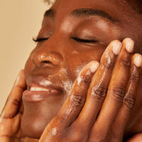 woman washing face with skin and tonic jelly cleanser