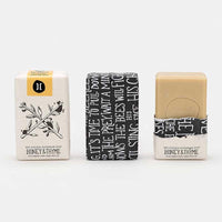 honey and thyme olive oil soap in paper packaging