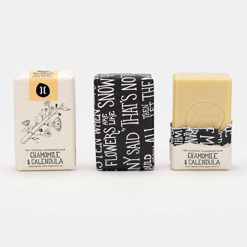 chamomile olive oil soap bar in paper packaging