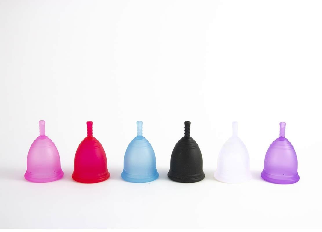 6 period cups in different colours in a line