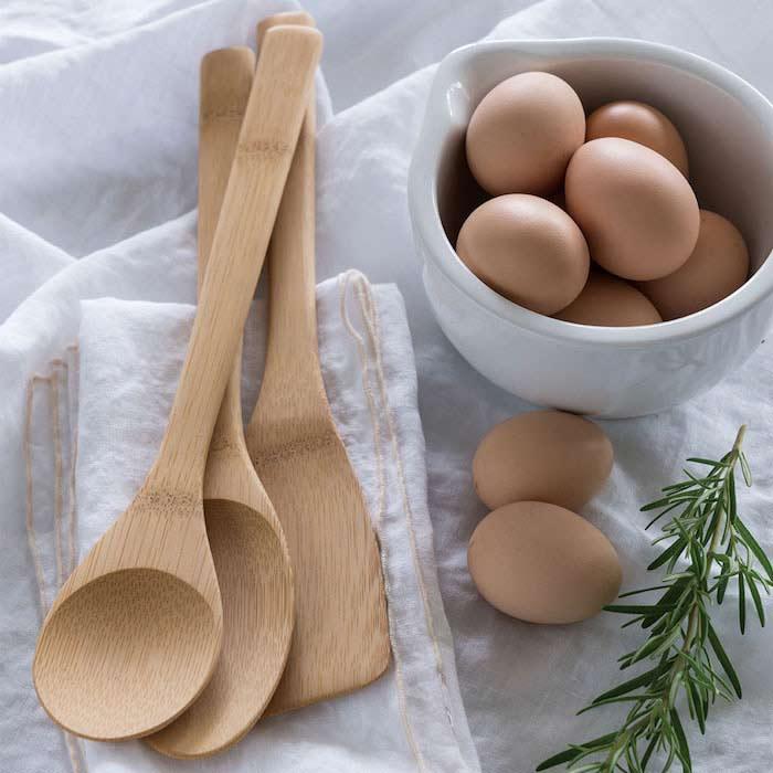 bamboo utensil set on a table with eggs