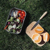 sustainable reusable salad sandwich box with bamboo lid black and blum outdoors with oranges