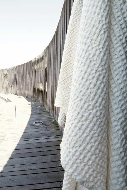 large waffle towel and blanket hanging outside