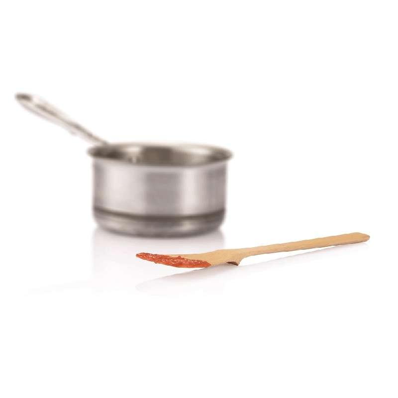 bamboo spoon next to saucepan