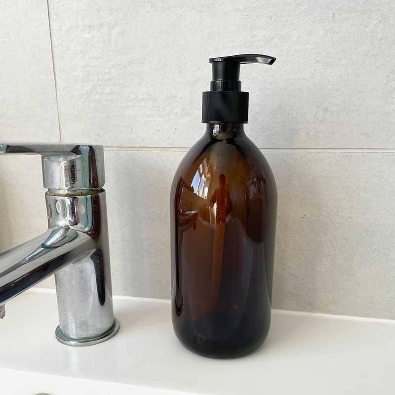 glass pump bottle in bathroom