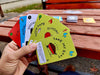 man holding social responsibility card game