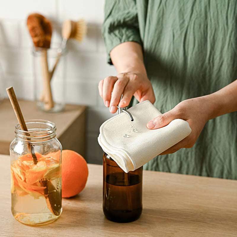 woman using organic cloth in kitchen