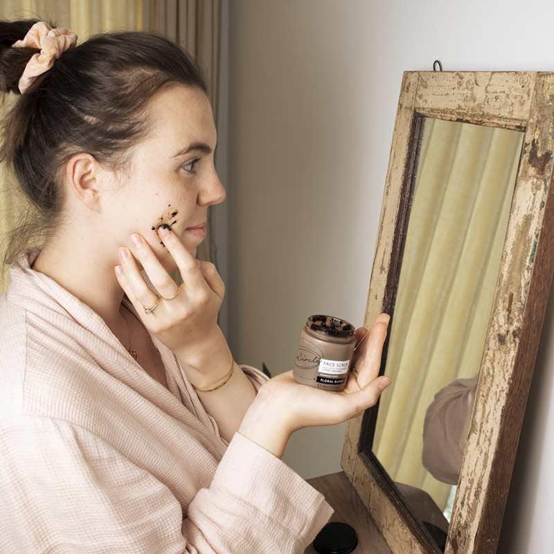 woman using coffee face scrub