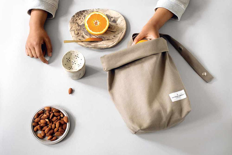 organic cotton lunch bag on a table with food