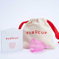 ruby cup period cup next to cotton bag